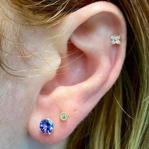 tanzanite yellow gold studs on ear