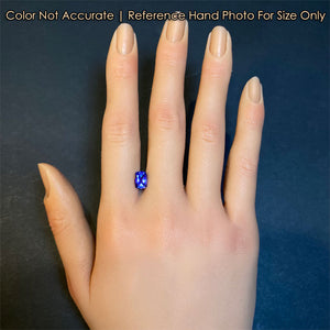 antique cushion cut tanzanite gem on hand