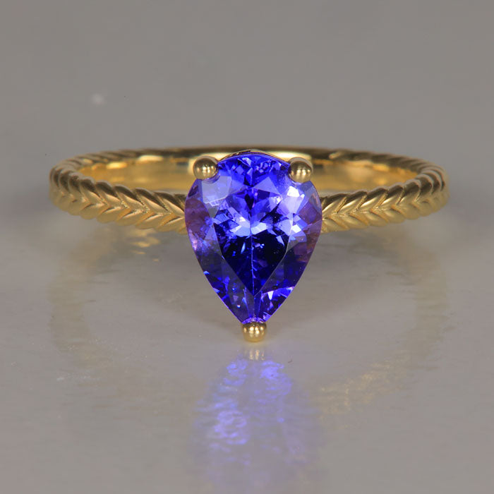 blue violet pear shape tanzanite gemstone ring yellow gold