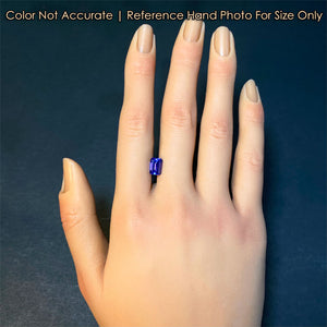 tanzanite gemstone on hand emerald cut