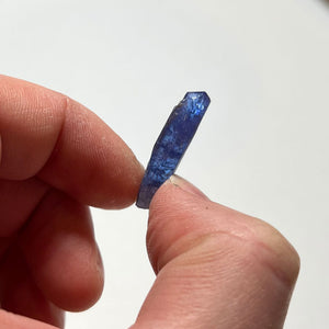 tanzanite crystal in hand tall