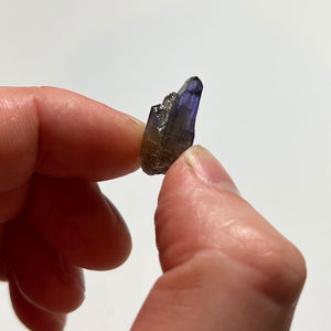 unheated tanzanite crystal in hand