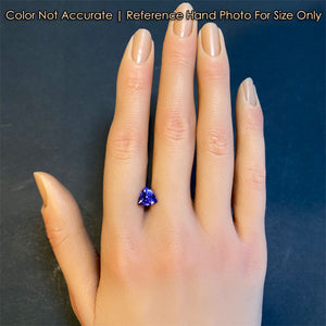 tanzanite gemstone trilliant cut on hand