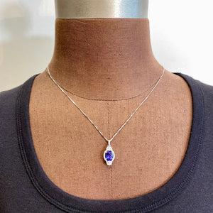 white gold tanzanite and diamond pendant