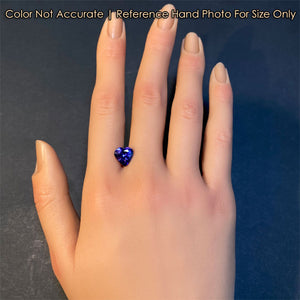 blue violet heart tanzanite gem on hand