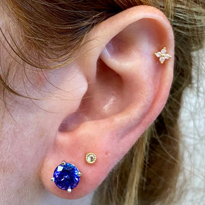 tanzanite studs on ear blue violet gems