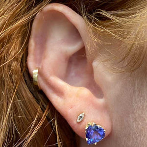 blue violet tanzanite heart studs on ear