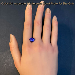 heart tanzanite gem on hand