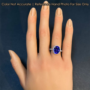 size of white gold and tanzanite with diamond ring