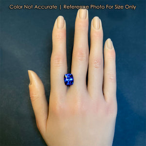 antique cushion cut tanzanite on hand for size