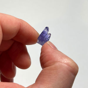 tanzanite in hand with double termination