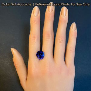 oval tanzanite gem on hand