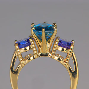 yellow gold and blue zircon ring with tanzanite accents