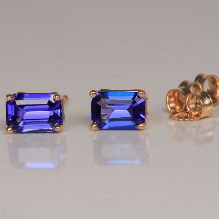 emerald cut tanzanite stud earrings in yellow gold