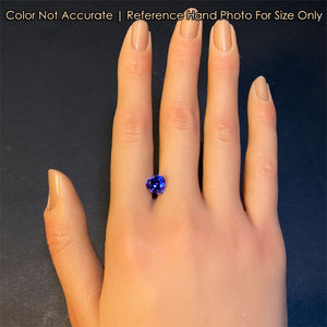 heart tanzanite gem on hand