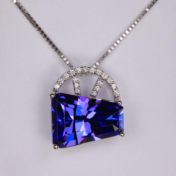 blue violet tanzanite gemstone pendant in white gold with diamonds