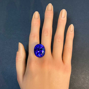 oval cut tanzanite large beautiful gem on hand