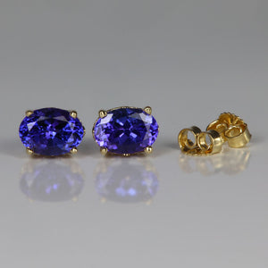 oval cut tanzanite gemstone earrings in yellow gold 