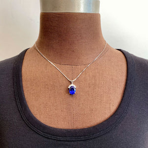 tanzanite and diamond accent pendant on form