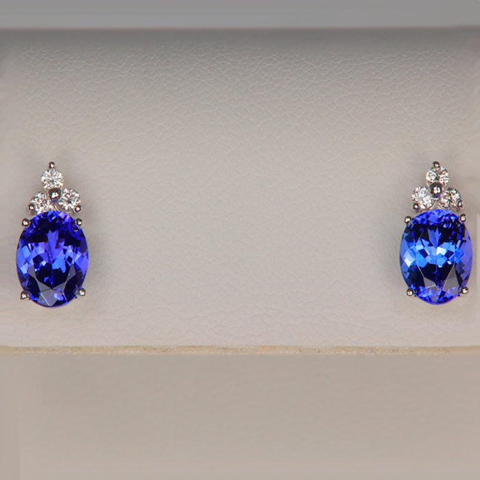 violet blue tanzanite gemstones oval cut with diamonds in white gold earrings 