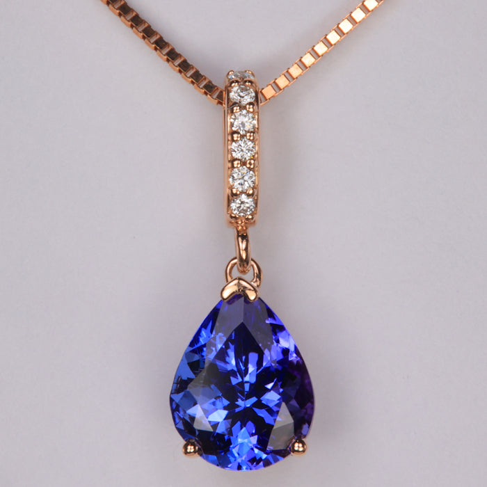 pear shaped tanzanite gemstone in 14k rose gold with diamond accents 