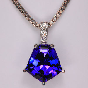 blue violet shield cut tanzanite gemstone pendant with diamond accents in white gold