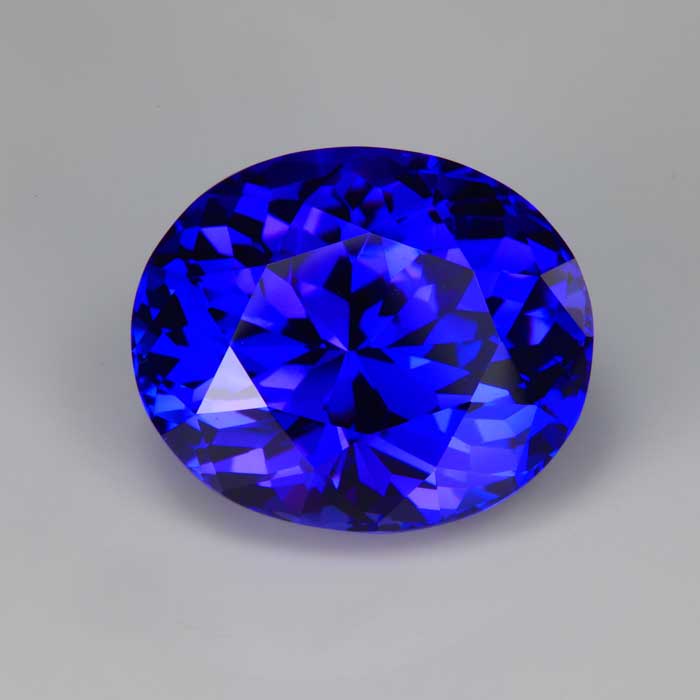 oval cut large tanzanite gemstone vivid red highlights