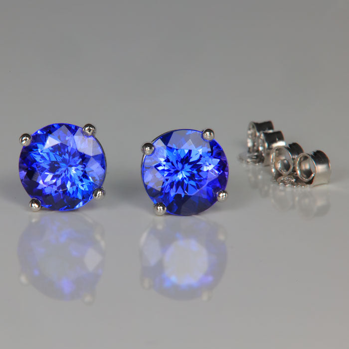 mostly blue tanzanite stud earrings in white gold