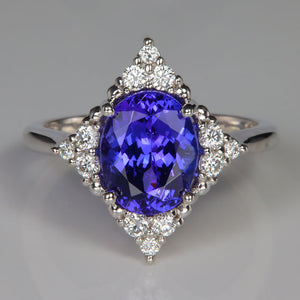 Oval tanzanite gemstone in white gold ring with diamonds