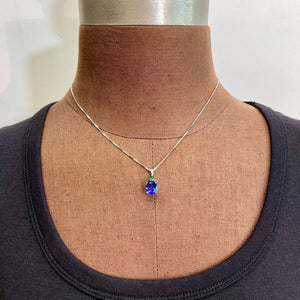 white gold tanzanite gem and tsavorite pendant