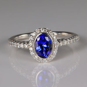 oval tanzanite gemstone bezel set in white gold ring with diamonds