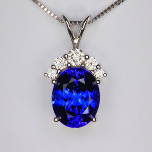 oval tanzanite and diamond pendant in white gold