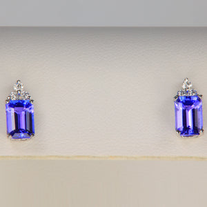 emerald cut tanzanite gemstone earrings with diamond accents in white gold