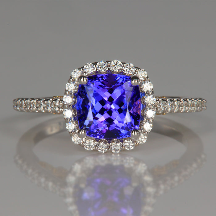 square cushion cut tanzanite gem in white and yellow gold ring with diamond accents 