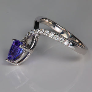 tanzanite ring on the side with diamonds