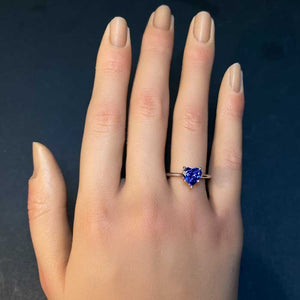 white gold tanzanite ring on hand heart shape