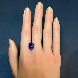 oval cut tanzanite gemstone on hand