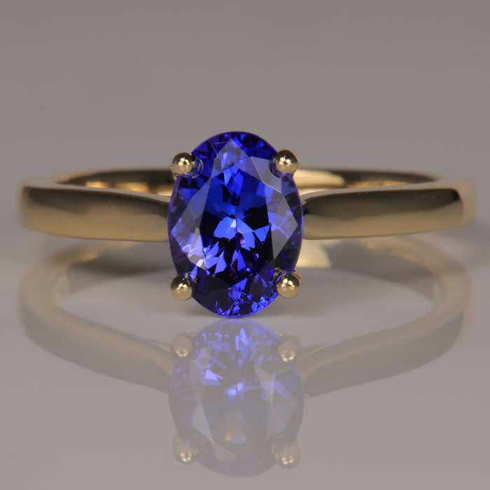 oval tanzanite ring yellow gold solitaire