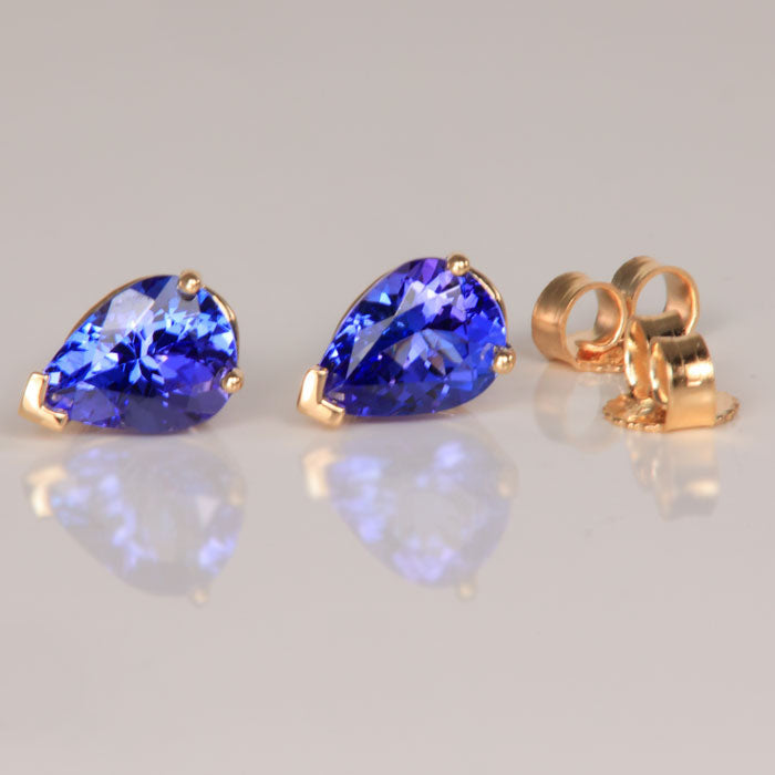 yellow gold three prong pear shape tanzanite stud earrings