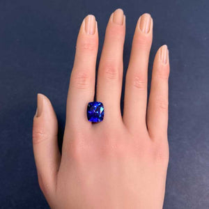 antique cushion cut tanzanite on hand