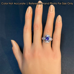 tanzanite ring on hand in white gold with diamonds