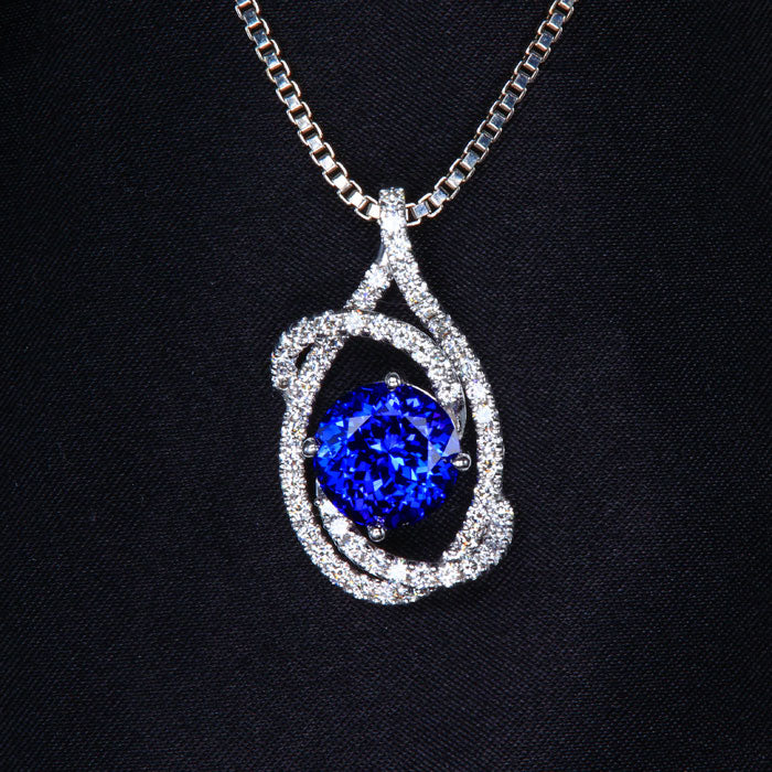 White Gold Tanzanite and Diamond Swirl Pendant