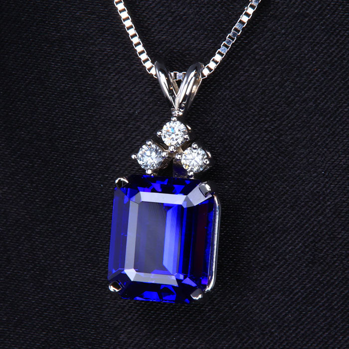 Emerald Cut Tanzanite and Three Diamond Pendant