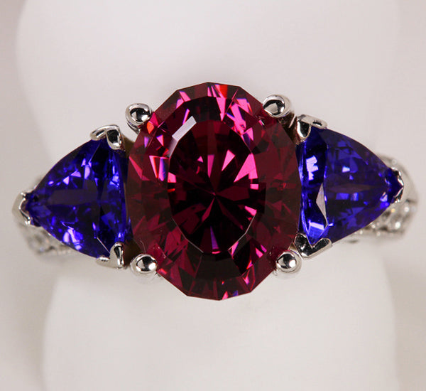 Gem quality Rhodolite Garnet Accented by Trilliant Tanzanites and Fine Diamond 